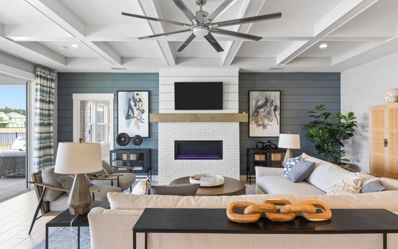 Bright living room with coffered ceiling, photographed for a listing