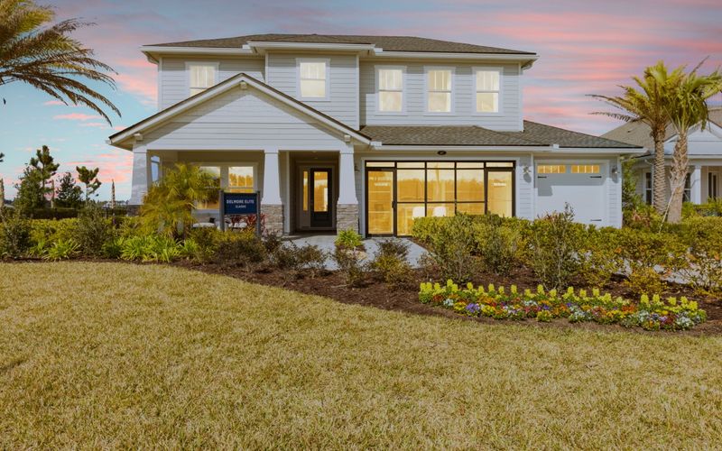Home at twilight with warm lit windows